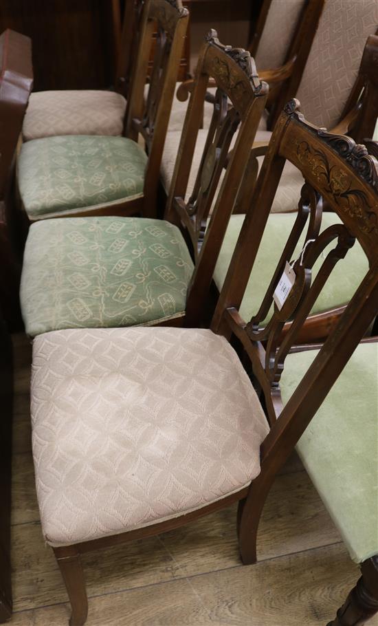 An Edwardian marquetry inlaid mahogany six piece boudoir suite, consisting of a ladys and gentlemans chair and four boudoir chairs